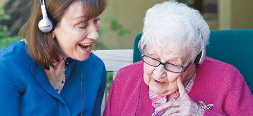 Maribeth Gallagher with patient Sue Crawford, 100, at Gardiner Home. 